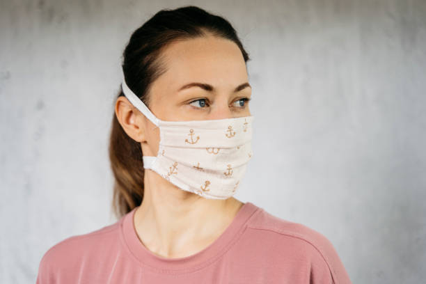 istock Young woman wearing mouth protection 1222461463