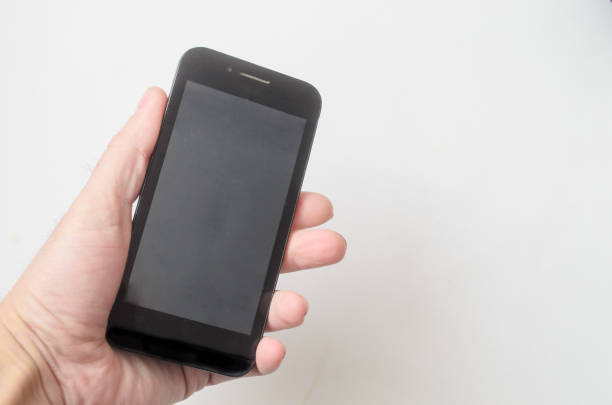 istock Man holds the smartphone in hand on white background.Space for text. 1222462609