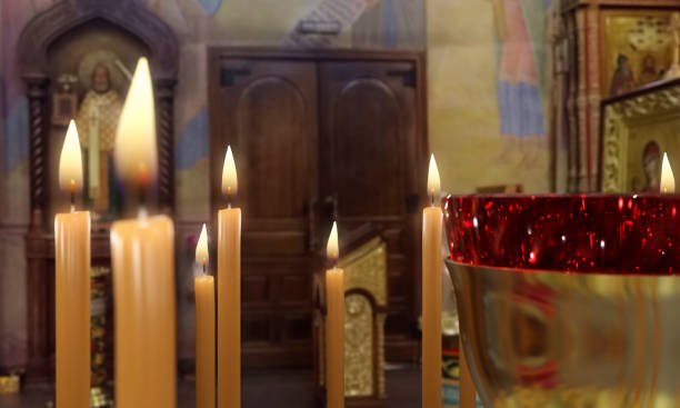 istock Candle on Candlestick Holder in Church 1222463173