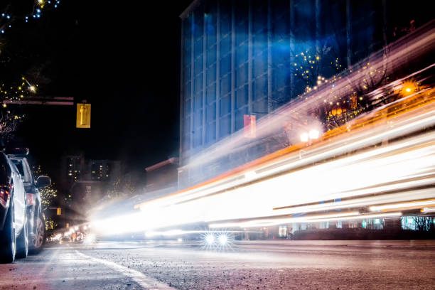 istock Long Exposure - City Street - Headlights going by 1222463248