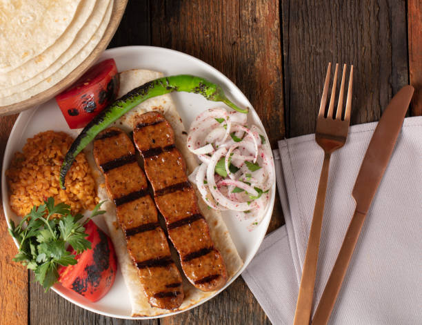 istock Turkish Adana Kebap With Rice Pilaf And Vegetables Served On A Plate 1222463314