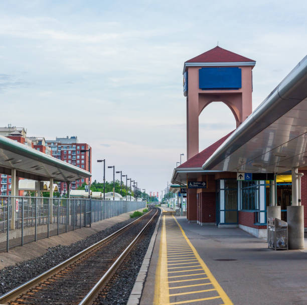 Train Station in the Daytime with City Skyline in the Background stock photo