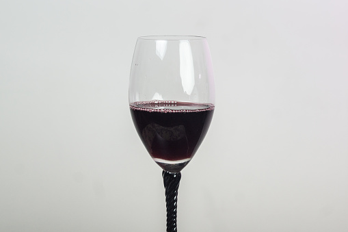 Wine Glass Half filled with Red Wine