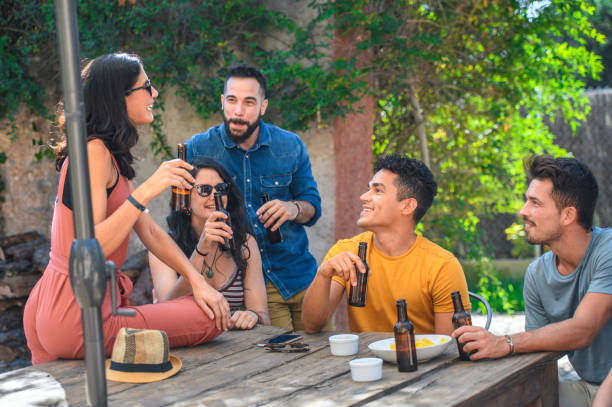 istock Friends Relaxing Outdoors with Beers and Snacks 1222464570