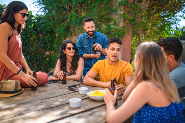 istock Friends Socializing in Outdoor Courtyard with Beer 1222464614