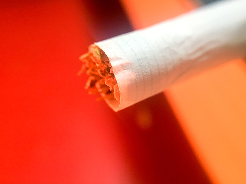 Cuban cigar with smoke over black