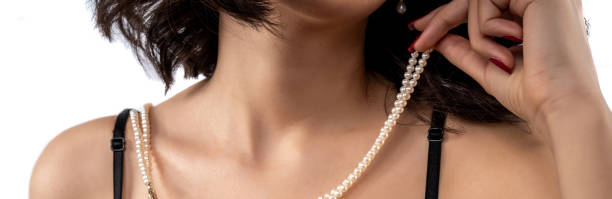 istock woman wearing pearl diamond necklace 1222466767
