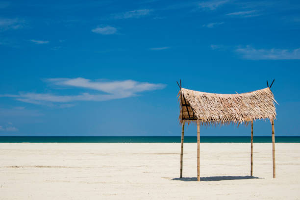 Inviting Shade Palapa on an Empty Beach on Borneo, Malaysia stock photo