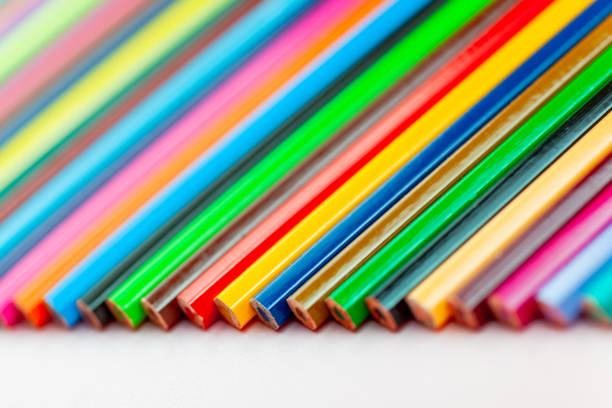 istock color pencils laid out in a row on a white background, close-up 1222467769