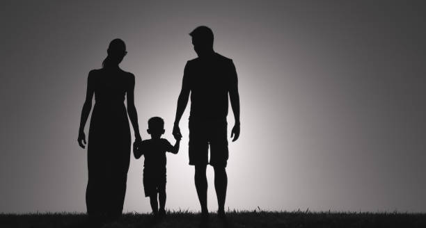 istock Family walking at sunset 1222468695