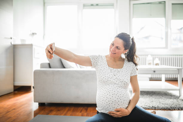 istock Nine months pregnant woman exercising 1222468824