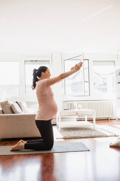 istock Nine months pregnant woman exercising 1222468877