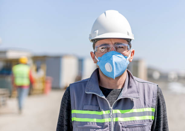 istock The worker is using protective mask for coronavirus (covid-19) epidemic in construction field. Coronaviruses vary significantly in risk factor. Some can kill more than 30% of those infected. 1222468928