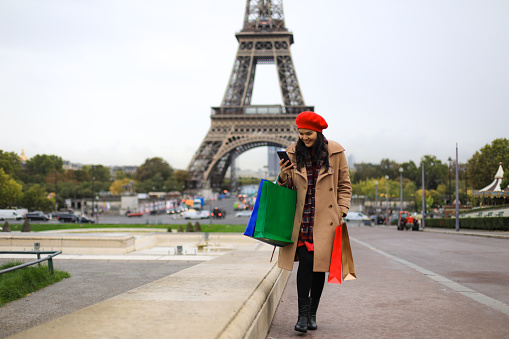 young asian woman traveling and shopping in Paris, France