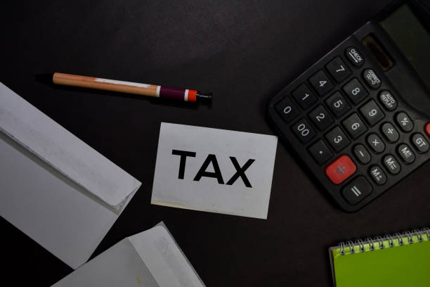 istock Tax write on a sticky note isolated on office desk. 1222471537
