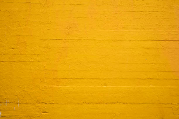 istock Textured concrete wall painted sunflower yellow 1222474985