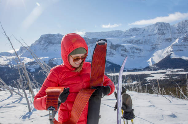 istock Female backcountry prepares to ski 1222475551