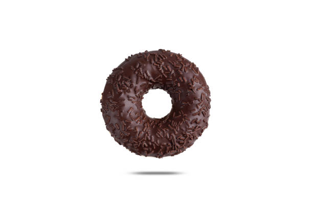 fresh donut with chocolate icing and chocolate powder isolated on a white background - high angle view brown directly above photography imagens e fotografias de stock