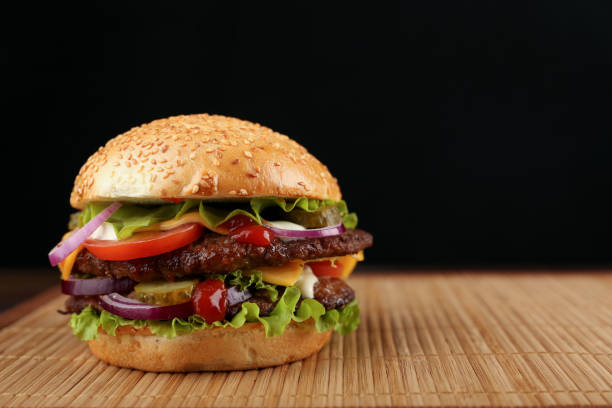 istock fresh homemade burger close up with copy space. 1222475941