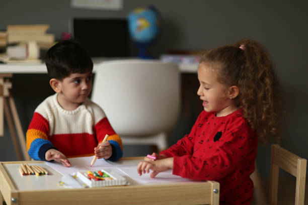 istock Brother and Sister Painting 1222476715