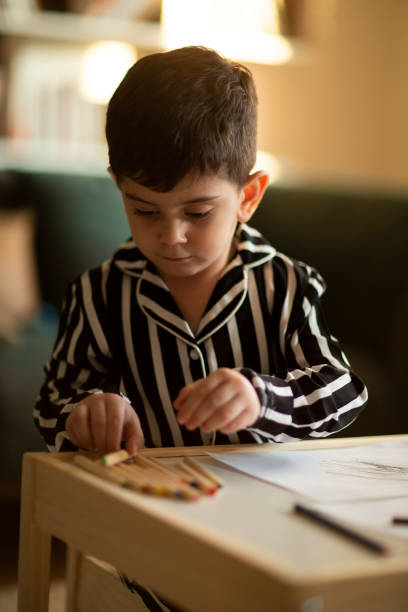istock Adorable little boy, drawing picture 1222478307