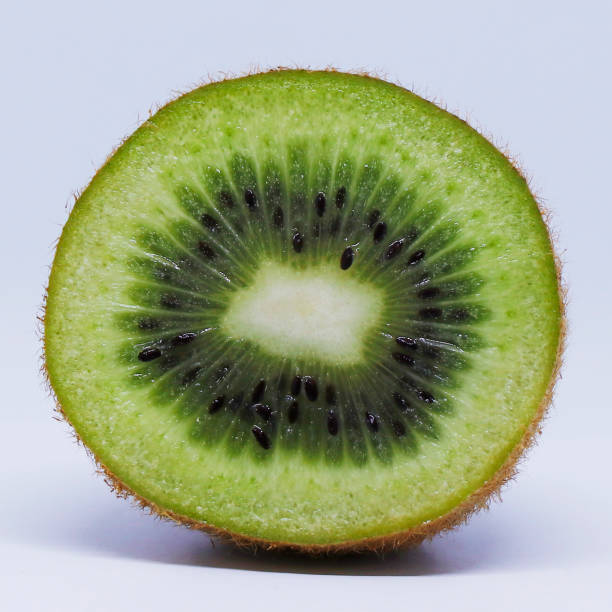 istock fresh kiwi fruit cut in to half, isolated 1222479326