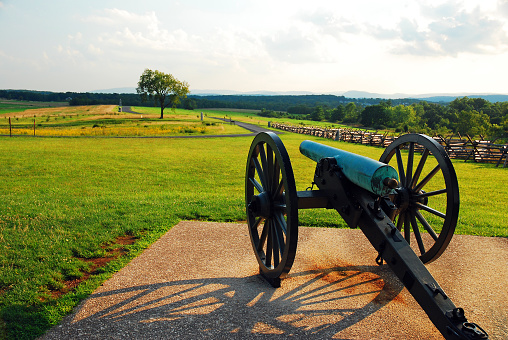 A cannon aims down the road at Oak Hill in the Gettysburg National Battlefield