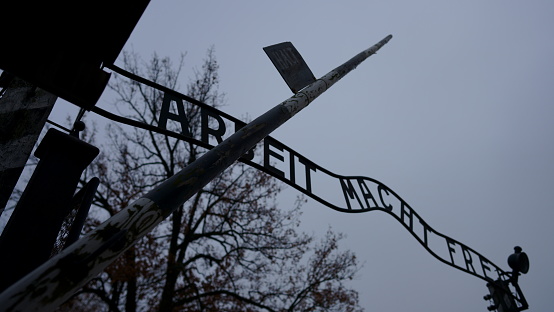 Auschwitz, Poland - November 15, 2019: The picture of the main gate to concentration camp- in Oswieciem, Poland.