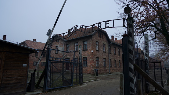 Auschwitz, Poland - November 15, 2019: The picture of the main gate to concentration camp- in Oswieciem, Poland.