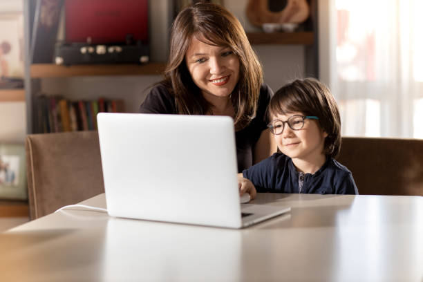istock Mother and Boy with Laptop 1222481086