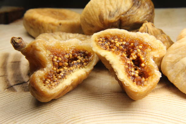 istock Close-up dried figs on wooden background 1222482882