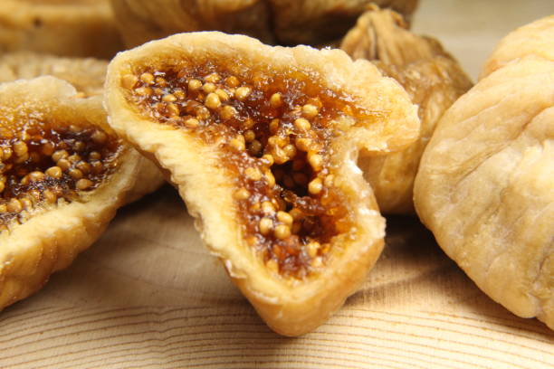 istock Close-up dried figs on wooden background 1222482914