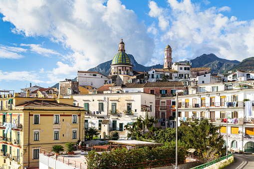 Ancient pastel-colored buildings are lined up along the marina of Santa Margherita Ligure