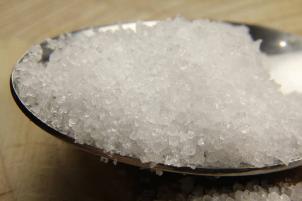 istock close-up photo of salt from spoon 1222485487