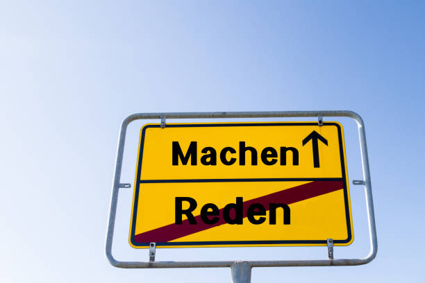 Making instead of Talking german "Machen Reden" stock photo