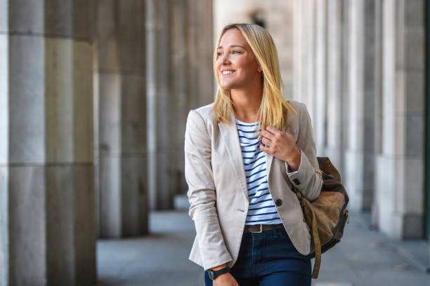 istock Cheerful Female Law Student Walking in University Colonnade 1222487231