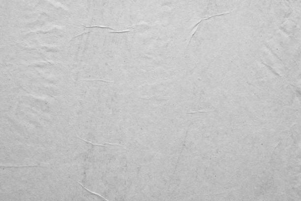 istock Blank white crumpled and creased paper poster texture background 1222487290