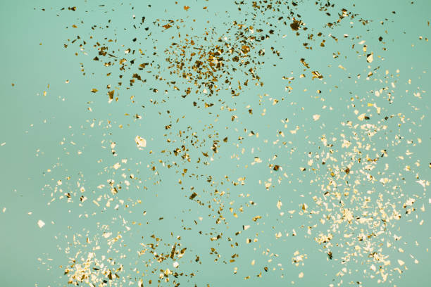 istock Golden flying sparkles on blue holiday background. 1222487296