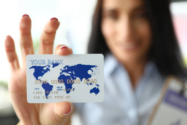 istock Female hand holding plastic card 1222488045
