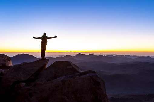 Man with open arms. Mount Sinai, Mount Moses in Egypt. Africa.