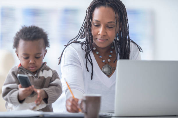 istock Mother and young son working from home 1222492676