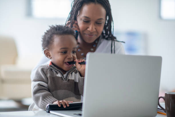 istock Mother and young son working from home 1222492689