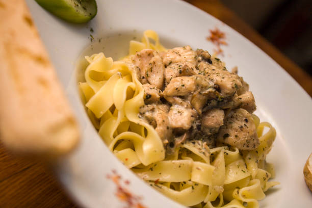 istock chicken cake in white plate - chicken pasta 1222494480