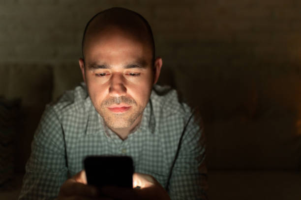 istock Serious man looking at a smartphone 1222495818