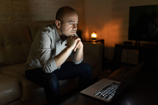 istock Watching TV show on a laptop at night 1222495895