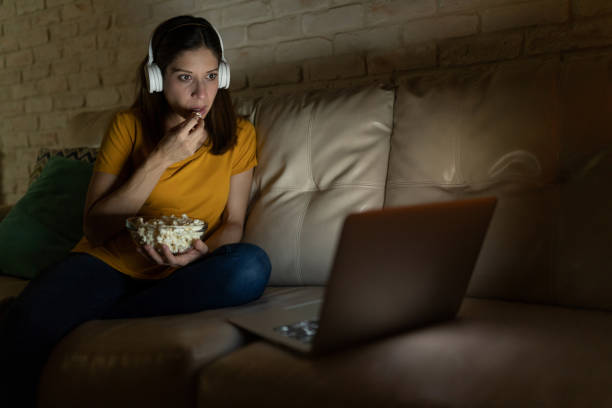 istock Wacthing movies at night on a laptop 1222496020