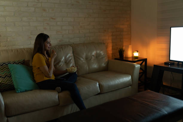 istock Watching a movie on TV at night 1222496042