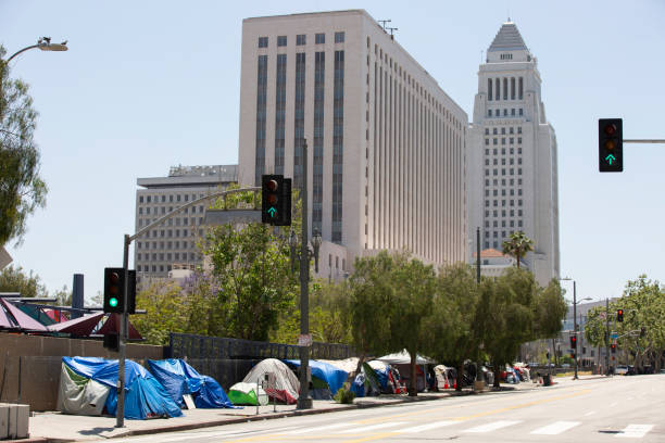Los Angeles Homelessness A massive tent encampment of homeless individuals on a Downtown Los Angeles sidewalk. homelessness stock pictures, royalty-free photos & images