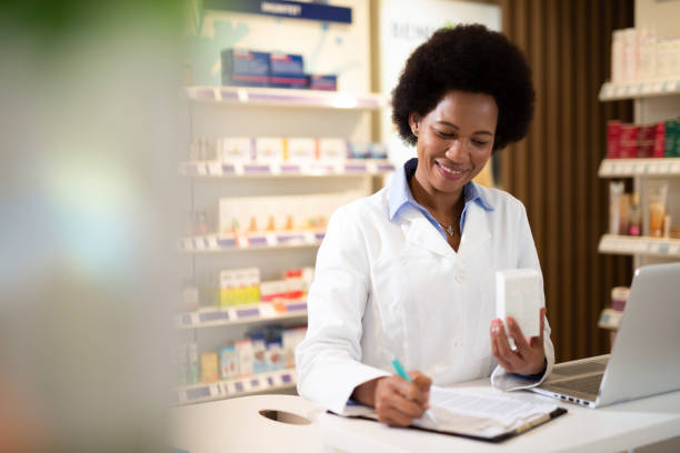 istock Happy Pharmacist Prescribing a Medicine. 1222500436