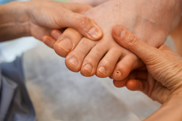 istock woman master pedicures a man. 1222501305